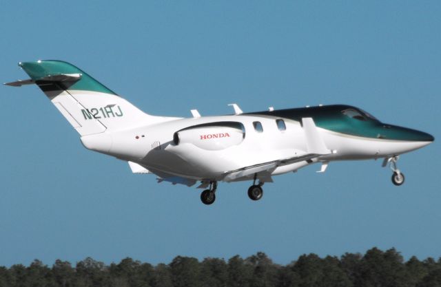 Honda HondaJet (N21HJ) - Honda Jet landing RWY 18 in Tallahassee... finally!