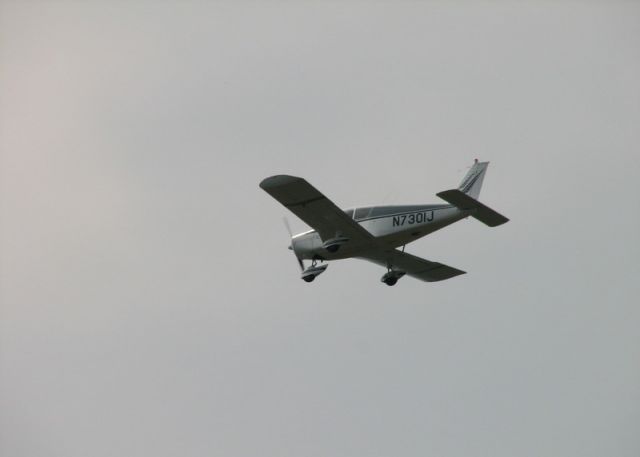 Piper Cherokee (N7301J) - Jill Tallman's Cherokee Flying over Penns Cave, PA.  I think I shot this on the grounds of the Nittany Antique Tracotr show.