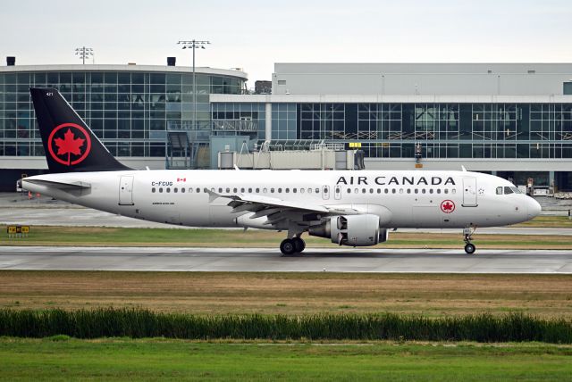 Airbus A320 (C-FCUG) - The half finished livery. The bottom of the body and engines covers were not painted black. The roundel is missing.