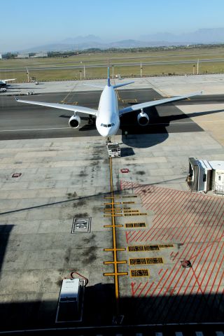 Airbus A330-300 (ZS-XSS) - You get an idea of the number of aircraft types that use this gate at Capetown by the tarmac markings