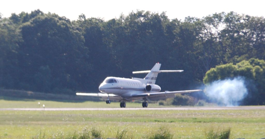 Dassault Falcon 20 (N954H) - A Hawker 800 lands at Monmouth Jet Center, NJ