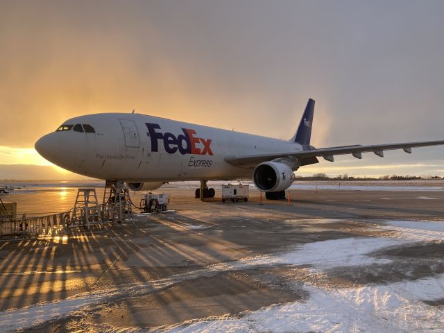 Airbus A300F4-600 (N728FD) - FDX Airbus "Casie" is soon to be loaded at Appleton International on a late winter's day.br /br /A reclined aircraft ladder providing a neat shadow effect.  