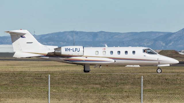 Learjet 31 (VH-LPJ) - Learjet taxies to runway 19. Flying in support role with the RAAF 2OCU, Operational Conversion Unit, responsible for transitioning Fighter Pilots from the HAWK Trainer, to the F-18 Classic Hornet.