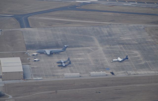 Lockheed C-130 Hercules (N5103D) - Overview of Lockheed Martin at Donaldson Center Airport.  The LM100J, two other C-130s and a C-5M Super Galaxy.