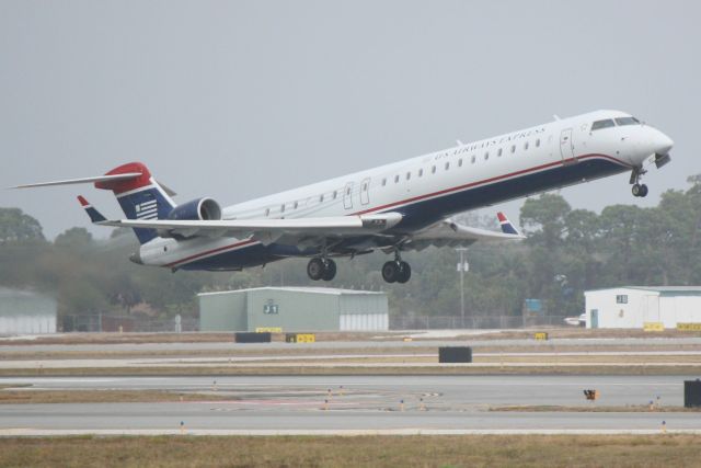 Canadair Regional Jet CRJ-900 (N927LR) - Mesa Airlines/US Airways Express Flight 2646 (N927LR) departs Runway 14 at Sarasota-Bradenton International Airport enroute to Charlotte/Douglas International Airport