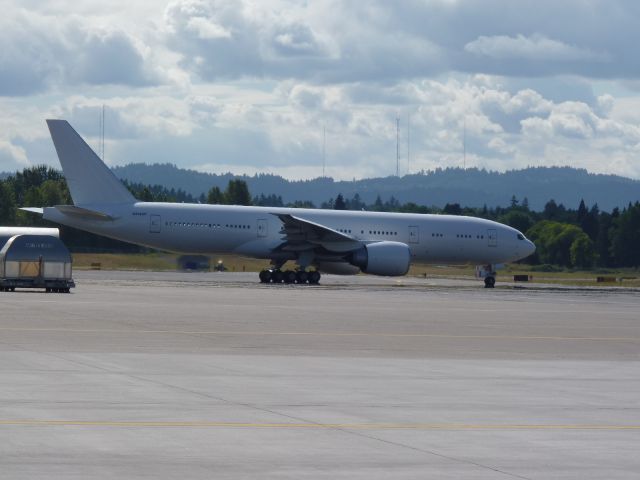 BOEING 777-300 (N5028Y) - Just out of the paint hanger, but its all white with a temp tail number. August 2010