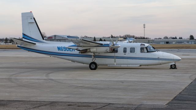 Rockwell Turbo Commander 690 (N690EH) - A Rockwell 690A sits on the ramp at Corporate Wings.