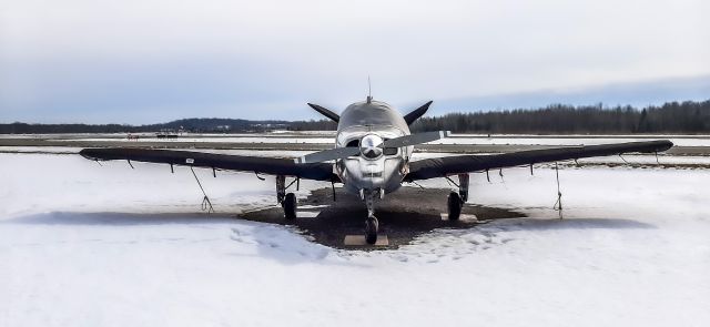 C-GNIN — - This 1947 Beech 35 (C-GNIN) seemed happy to see me as it sat alone on the freezing tarmac. Photo taken at Peterborough airport (CYPQ), Ontario, Canada