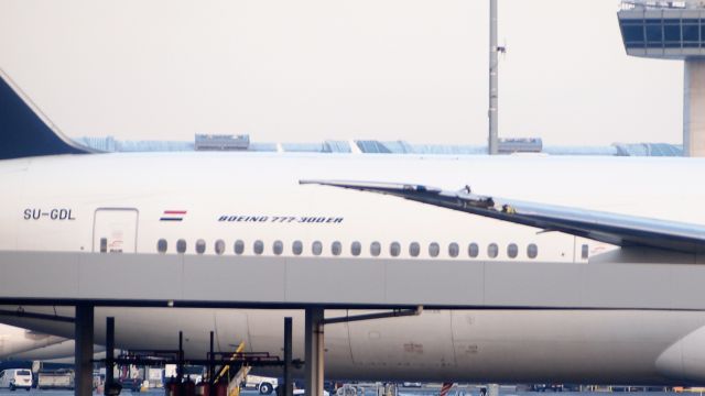 BOEING 777-300ER (SU-GDL) - SU-GDL is parked on the ramp outside of JFK Terminal 4 after suffering wingtip damage in a taxi incident with G-VRAY.