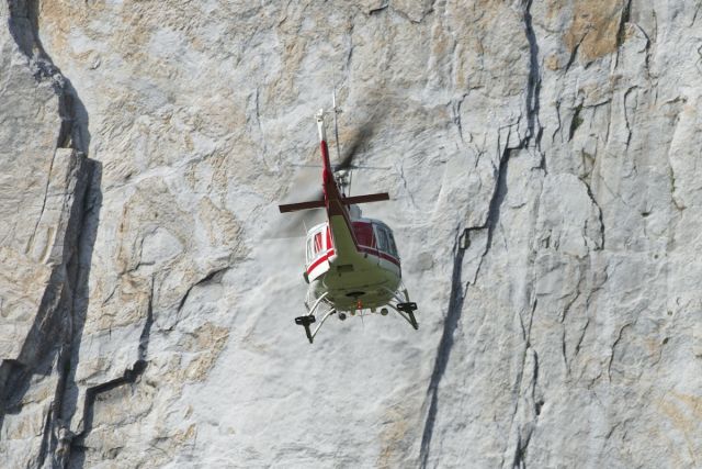 N28HJ — - Watching the park rangers/climb rescue practice their skills. This Bell 205A was taking off from the meadow at the bottom of El Capitan in Yosemite CA, in this photo heading towards Cathedral Rocks to circle back to the top of El Capitan.