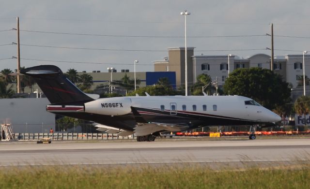 Bombardier Challenger 300 (N586FX) - Taxing for a take off from MIA on the evening of the 20th of June, 2018.