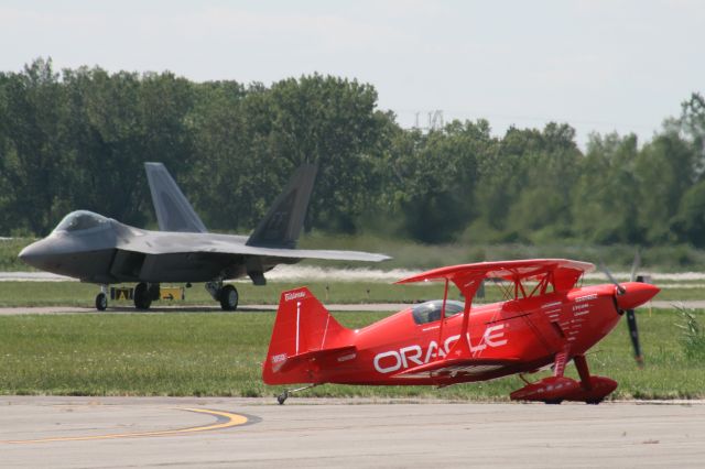 — — - This picture dates back to 8/15/2008 this was the first time the F-22 Raptor (foreground) was at the Gary Regional Airport.  Sean D. Tucker from Team Oracle is up front returning from his performance at the Chicago Air and Water Show.  The Raptor is taxiing to Runway 30 to takeoff for its performance at the air show.  