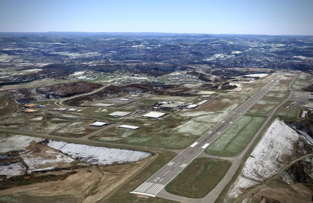 — — - Aerial view toward the SE over RWY 21 at CKB