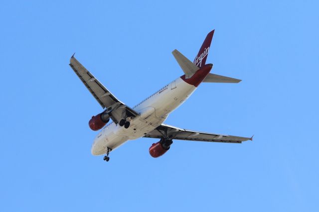 Airbus A319 (N521VA) - Virgin America (VX) N521VA A319-112 [cn2773]br /Dallas Love Field (DAL). Still flying in Virgin America livery 23 months after the acquisition by Alaska Airlines this Alaska Airlines flight AS1874 on final approach to Dallas from Los Angeles (LAX).  br /Taken from SpeedyZone amusement park beside I35E br /2018 03 10   a rel=nofollow href=http://alphayankee.smugmug.com/Airlines-and-Airliners-Portfolio/Airlines/AmericasAirlines/Virgin-America-VX/https://alphayankee.smugmug.com/Airlines-and-Airliners-Portfolio/Airlines/AmericasAirlines/Virgin-America-VX//a