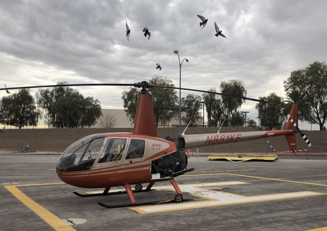 Robinson R-44 (N881KE) - Standing at 702 Aviation’s helipad while some maintenance is being performed. (KVGT-West Ramp)