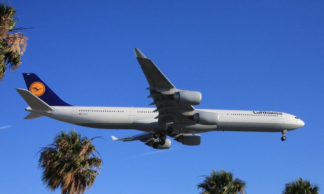 Airbus A340-600 (D-AIHU) - On short final to 24R, from the park across from In N Out