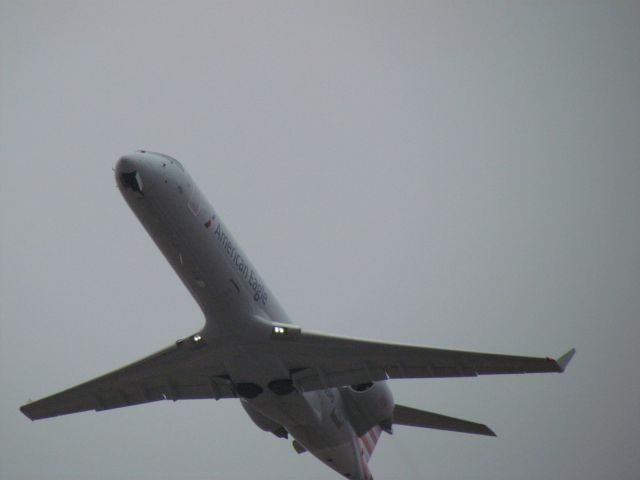 Canadair Regional Jet CRJ-700 (N725PS) - ...Just after takeoff from runway 18L.