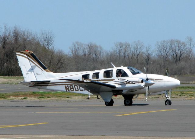 Beechcraft Baron (58) (N80LM) - At Downtown Shreveport.