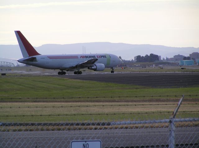 BOEING 767-200 (N793AX) - Approach end of 28L, sundown, August 21, 2010. Unusual paint scheme version.