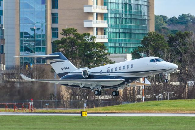 Cessna Citation Longitude (N75RA) - N75RA a 2020 Textron 700 was just clearing the runway on it's climb out from Atlanta's PDK executive airport. I shot this with my Canon 100-400mm IS II lens at a focal length of 255mm. The camera settings were 1/2000 shutter, F8 ISO 1000. I really appreciate POSITIVE VOTES and POSITIVE COMMENTS. Please check out my other aircraft photography. Questions about this photo can be sent to Info@FlewShots.com