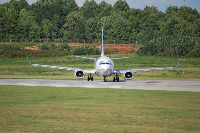 Boeing 737-500 (N17614) - Taxiing into position on runway 18C - 9/27/09