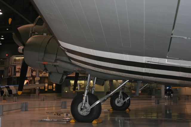 N315211 — - Note oil pans on the ground to save the EAA Floor from being stained.