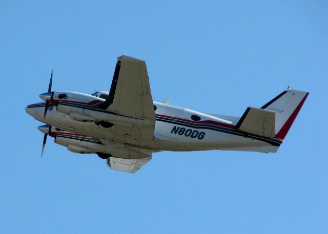 Beechcraft King Air 90 (N80DG) - Off of 32 at Downtown Shreveport. This aircraft was used in the movie, Wondeful World, starring Matthew Broderick. In the movie, it is seen departing and then Broderick deplaning in Senegal. The take-off is runway 32 and the Senegal Airport are both at Shreveports Downtown Airport. And movie magic has the King Air flying from The U.S. to Senegal.