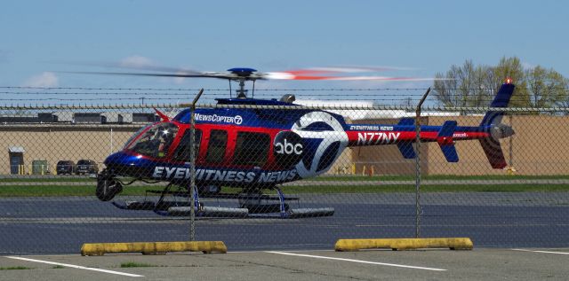 Bell 407 (N77NY) - LINDEN AIRPORT-LINDEN, NEW JERSEY, USA-APRIL 28, 2020: A helicopter from one of the local New York City T.V. stations is seen on the ground preparing for a hot refueling after covering the joint flyover of the Blue Angels and Thunderbirds over New York and New Jersey during Operation America Strong, a salute to frontline COVID-19 responders.