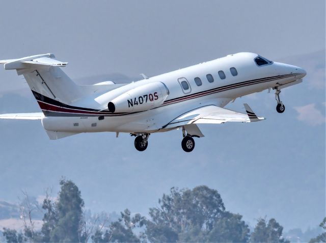 Embraer Phenom 300 (N407QS) - NetJets Embraer EMB 505, Phenom 300 departing Livermore Municipal Airport, Livermore CA. August 2020