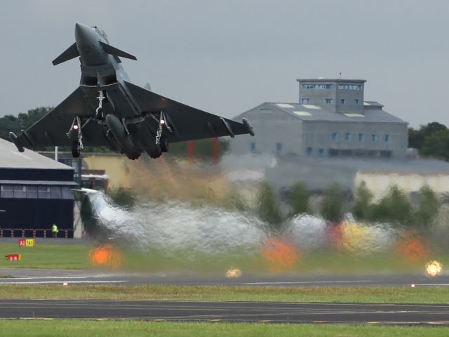 — — - An RAF Typhoon commences it's flying display at Farnborough International Airshow 2012.