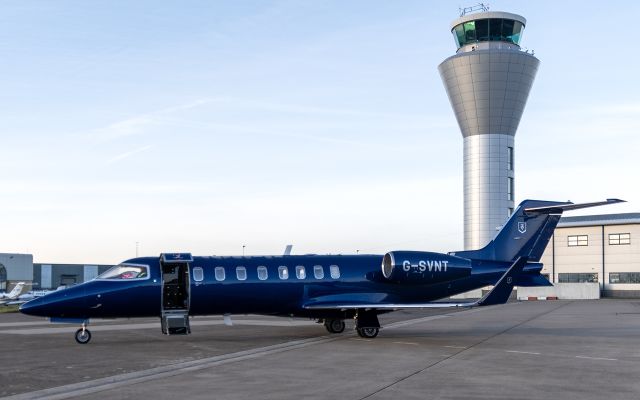 Learjet 45 (G-SVNT) - Learjet 45 parked next Jersey ATC control tower and approach building 13/Jan/2025 