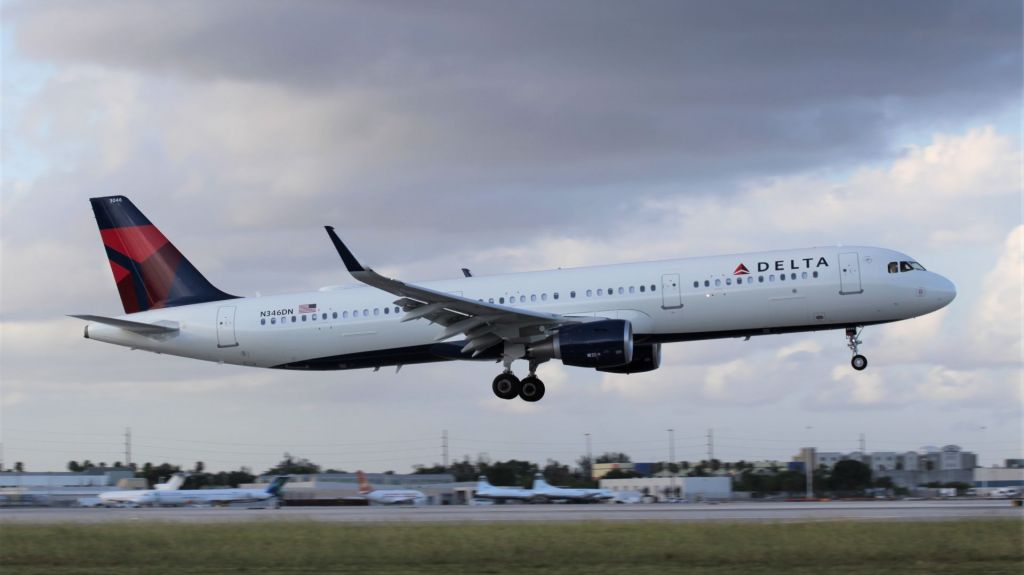 Airbus A321 (N346DN) - Shiny new Airbus 321-211 landing at MIA on the evening of the 26th of June, 2018. It has been in service since April.