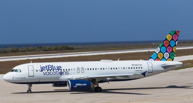 Airbus A320 (N623JB) - JetBlue vacations Playa-way With Me N623JB with there Airbus A320 seen taxing for departure at TNCM Hato Curaçao International Airport.br /Forest Beaches landscape and all the others!!