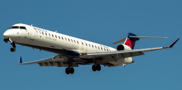 Canadair Regional Jet CRJ-900 (N831SK) - SkyWest Airlines (Delta Connection) CRJ-900LR arriving from Minneapolis landing on runway 29 at Newark on 9/6/21.