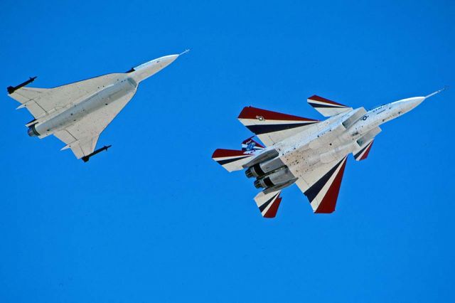 McDonnell Douglas F-15 Eagle (N837NA) - McDonnell-Douglas F-15 STOL Demonstrator N837NA and NASA General Dynamics F-16XL N849NA at Edwards Air Force Base on October 10, 1999. The horizontal stabilizers of an F/A-18 have been fitted as canards, and it is equipped with 360-degree vectored thrust nozzles. It was originally the first F-15B 71-290.