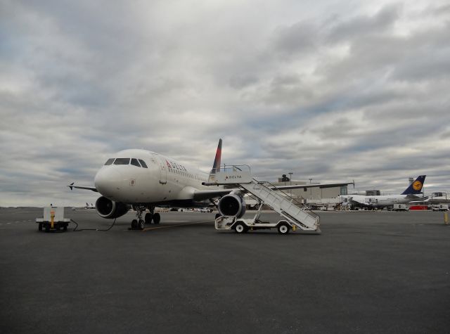 Airbus A319 (N330NB) - awaiting a tow up to the company gates- Terminal A  from North Cargo !