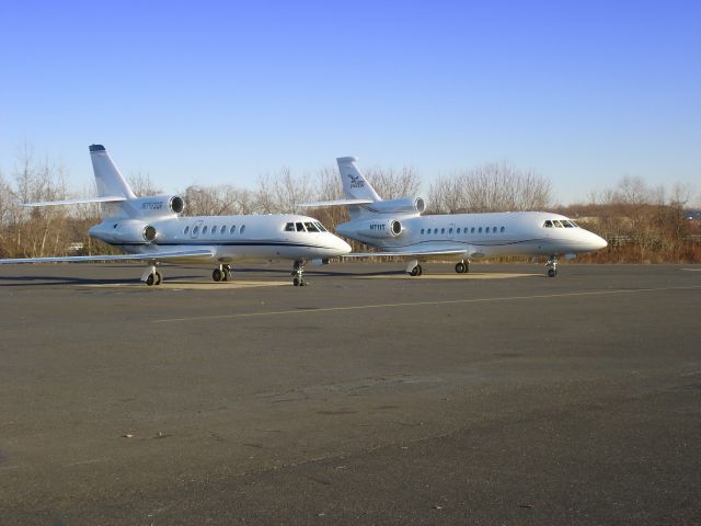 Dassault Falcon 900 (N711T) - Two Birds looking really good on the Tarmac with the Falcon 50 to the left of the 900EX in the Winter of 2006.