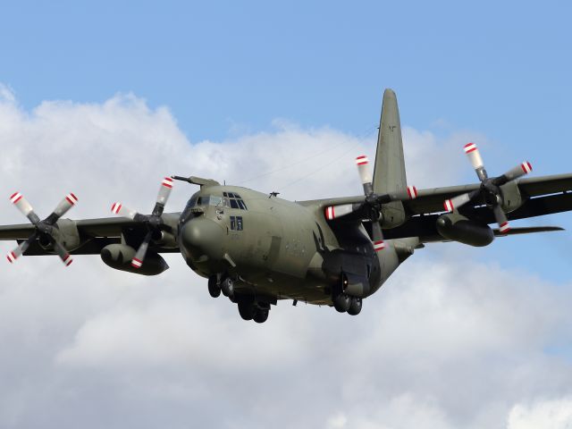 — — - A Lockheed C130K Hercules with refueling probe and various sensors mounted on front and rear of it's hull, returns to it's main base at RAF Brize Norton.