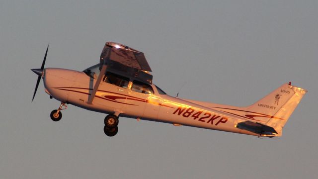 Cessna Skyhawk (N842KP) - Whiteside Co. Airport KSQIbr /2 Feb 2023br /Stunning light accentuates the sleek likes of this Cessna 172 as she takes to the air off of runway 36.br /Gary C. Orlando Photo.