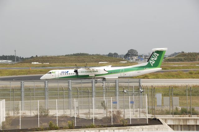 de Havilland Dash 8-200 (JA857A) - Taxi at NRT Airport on 2011/10/9 Green Eco c/s