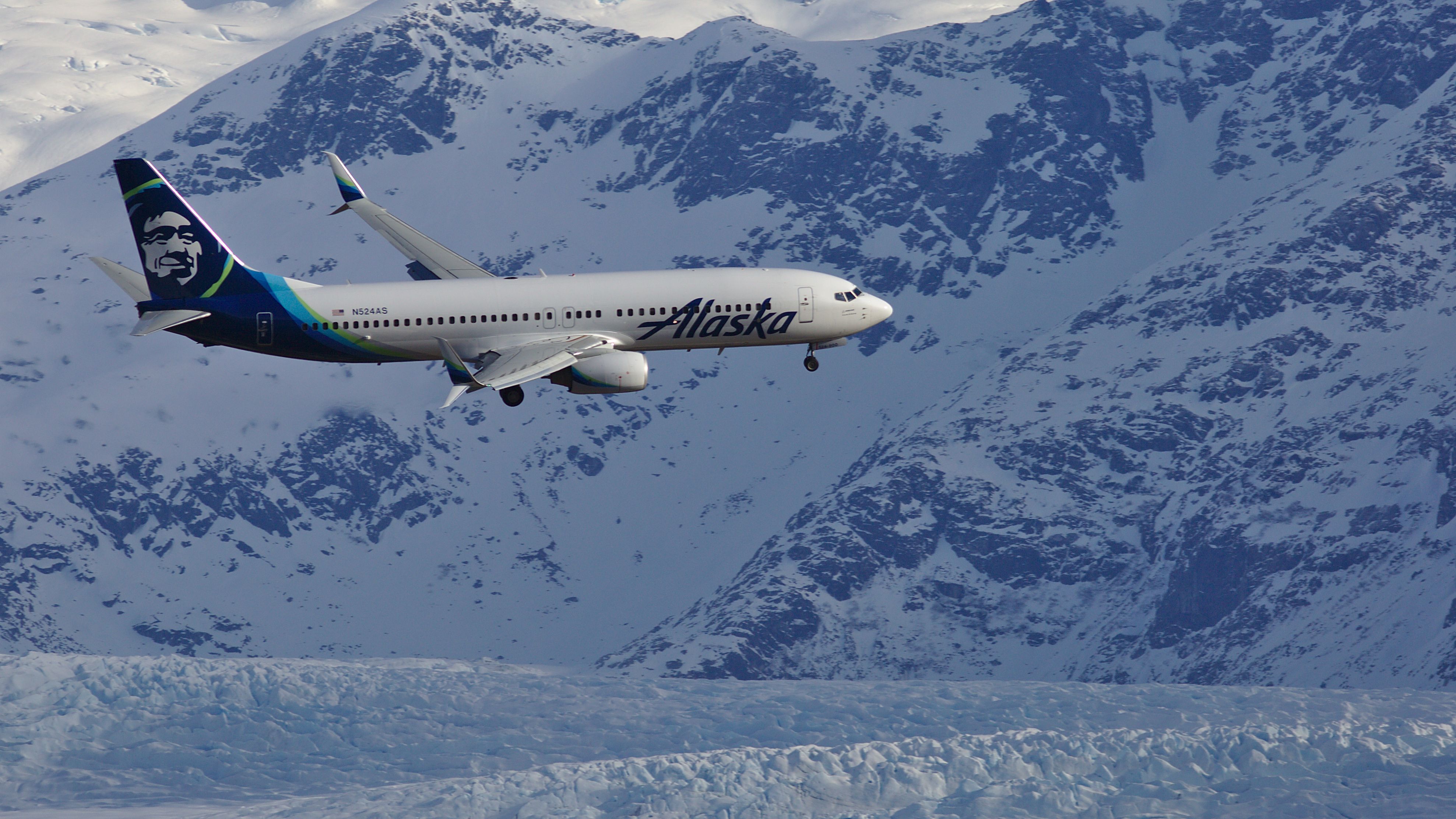 Boeing 737-800 (N524AS) - Walking the dog in the Mendenhall Wetlands, under JNU approach.  Mendenhall Glacier in the background.