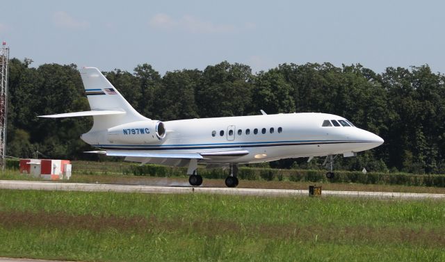 Dassault Falcon 2000 (N797WC) - A Dassault Falcon 2000 touching down on Runway 18 at Pryor Field, Decatur, AL - August 31, 2016, shot from the edge of the ramp nearest the taxiway.