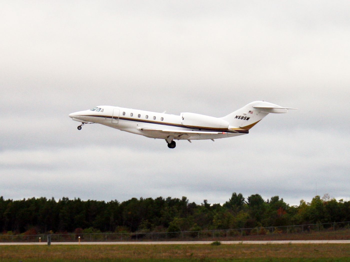 Cessna Citation X (N585M) - Menard, Inc. Citation X taking off KEAU and gear retracting.