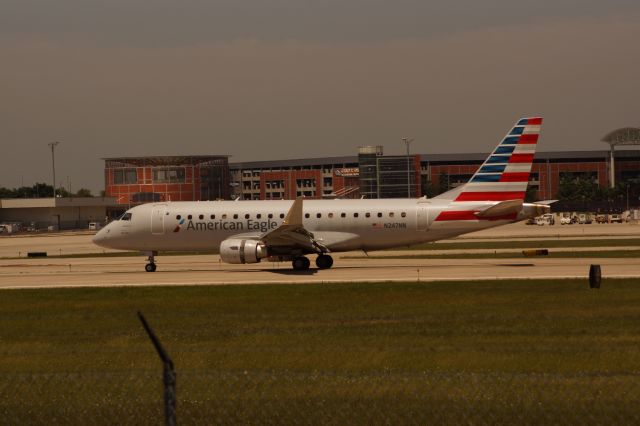 Embraer 175 (N247NN) - Envoy Air in the American Eagle E175 taking off from KGRR on a hot Tuesday afternoon. Photo was taken from the Grand Rapids spotter area.