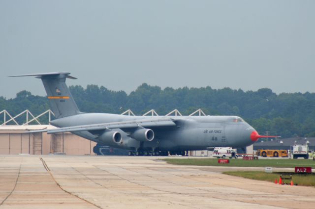 Lockheed C-5 Galaxy (86-0013) - 86-0013 (cn 500-0099) Freighter flashback Friday.. This was my first sighting of the very first Lockheed C-5M Super Galaxy at the beginning of the C-5 Reliability Enhancement and Re-Engining Program (RERP). On the afternoon of 22 Sep 2006, I watched it takeoff, circle around, and immediately return but didn’t have my camera. It experienced hot-brakes after it landed on RWY 11 and several blasts could be heard as multiple tires exploded from the increased heat/pressure. Luckily, I was able to grab my camera and while not the sharpest, I snapped these long-distance shots. Lockheed Firefighters and aircraft maintenance crews quickly took control of the situation. If you look closely, you can see the left-front main bogie is raised. 86-0013 was originally delivered in 1987 as a C-5B, converted to C-5M and later delivered to Dover AFB. It is still assigned to Dover AFB DE where the 436th AW & 512th AW are collocated.