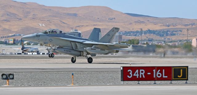 McDonnell Douglas FA-18 Hornet (16-9214) - "Vampire One One," an E/A-18G Growler (169214) of the Navys VX-9 "Vampires" (AIRTEVRON NINE = AIR T(est) (and) EV(aluation) (Squad)RON NINE, Naval Air Weapons Station, China Lake) is rotating away from Reno-Tahoe Internationals runway 16L as it rockets past my temporary spotting position at the intersection of taxiways Juliet and Charlie.