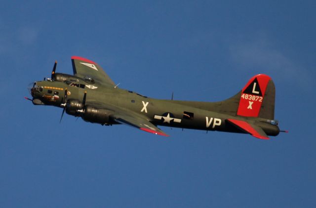 Boeing B-17 Flying Fortress (N7227C) - The Commemorative Air Force Gulf Coast Wing's Boeing B-17G Flying Fortress "Texas Raiders" on a fly-by at Folsom Field, Cullman Regional Airport, AL - late afternoon, November 6, 2022. The best shot I could get with my Canon T5 and the 55mm-250mm lens with the zoom fully extended.