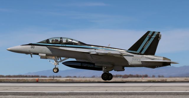 McDonnell Douglas FA-18 Hornet — - F/A-18F Super Hornetbr /Reg #: Disguised but the numerals 165798 are discernible.br /Two-seat F-18F landing at NAS Fallon after a morning film session in April, 2021. Tom Cruise occupies the rear seat.