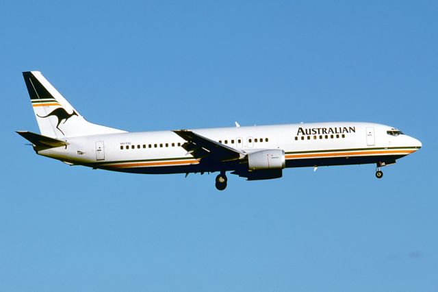 BELL-AGUSTA AB-139 (VH-TJG) - AUSTRALIAN AIRLINES - BOEING 737-476 - REG : VH-TJG (CN 24432/1879) - ADELAIDE INTERNATIONAL AIRPORT SA. AUSTRALIA - YPAD (6/10/1990)