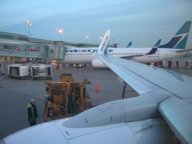 Boeing 737-800 (C-GWSA) - Westjet 737-800 parked at CYYZ.